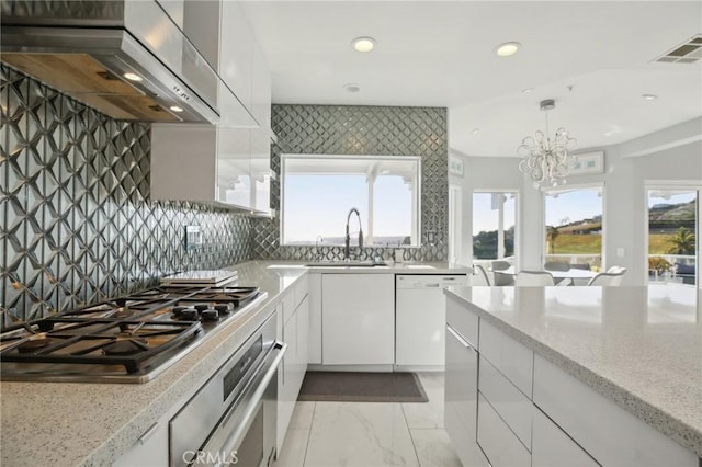 3 Via Pasa, San Clemente, CA 92673 - kitchen featuring wall chimney range hood, appliances with stainless steel finishes, recessed lighting, white cabinetry, and modern cabinets
