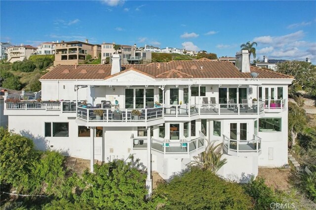 3 Via Pasa, San Clemente, CA 92673 - rear view of house featuring a chimney, stucco siding, and a balcony