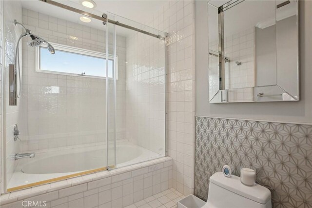 3 Via Pasa, San Clemente, CA 92673 - bathroom featuring tiled shower / bath, tile walls, and wainscoting