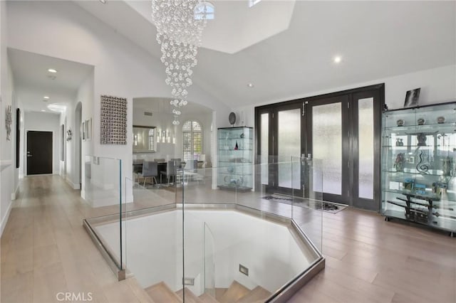 3 Via Pasa, San Clemente, CA 92673 - bathroom with recessed lighting, a chandelier, wood finished floors, french doors, and lofted ceiling