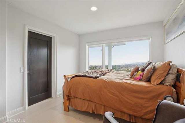 bedroom with recessed lighting and baseboards
