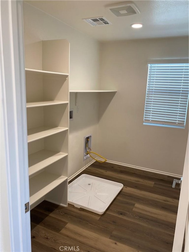 13110 Rosamond Ct, Hesperia, CA 92395 - laundry area featuring dark wood-style floors, recessed lighting, baseboards, and washer hookup