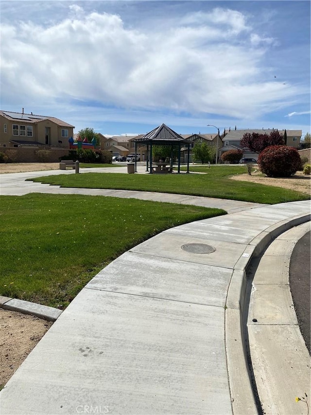 13110 Rosamond Ct, Hesperia, CA 92395 - surrounding community featuring a gazebo, a lawn, and a residential view