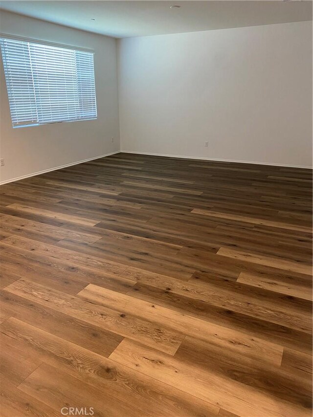 13110 Rosamond Ct, Hesperia, CA 92395 - spare room with dark wood-style floors