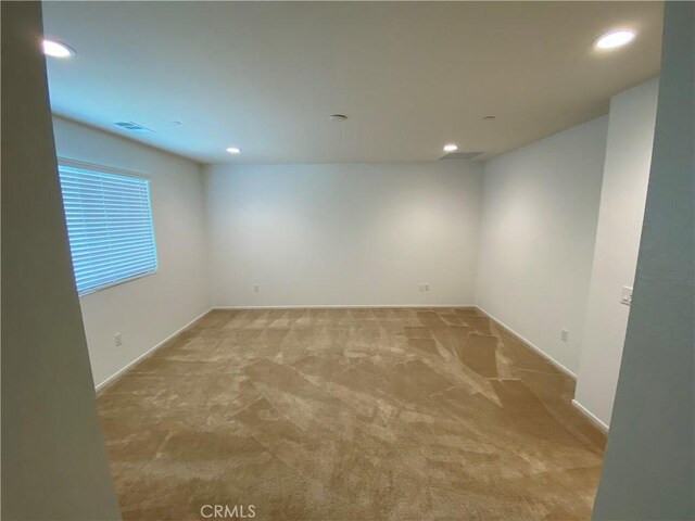 13110 Rosamond Ct, Hesperia, CA 92395 - spare room with light colored carpet, recessed lighting, and baseboards