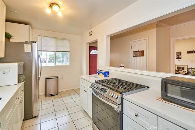 2624 W Cherry Ave, Fullerton, CA 92833 - kitchen featuring stainless steel appliances, light tile patterned floors, light countertops, and white cabinets