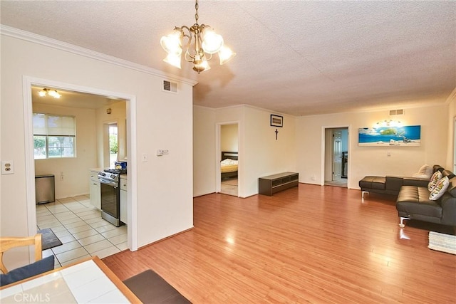 2624 W Cherry Ave, Fullerton, CA 92833 - living room featuring a textured ceiling, crown molding, light wood-style floors, and a chandelier
