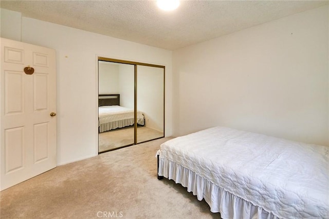 2624 W Cherry Ave, Fullerton, CA 92833 - carpeted bedroom with a closet and a textured ceiling