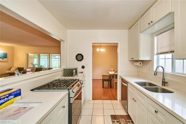 2624 W Cherry Ave, Fullerton, CA 92833 - kitchen with appliances with stainless steel finishes, plenty of natural light, white cabinets, and light tile patterned floors
