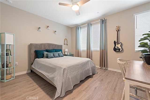 194 Tribeca, Irvine, CA 92612 - bedroom with light wood-style floors, a ceiling fan, and baseboards