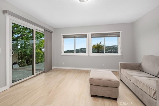 23875 Catamaran Way Unit 51, Laguna Niguel, CA 92677 - living room with light wood-style floors and baseboards