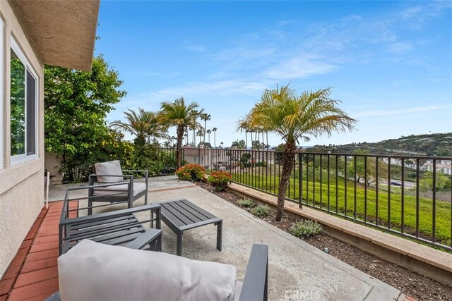 view of patio / terrace featuring fence