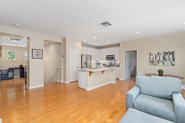 37 Rumford St, Ladera Ranch, CA 92694 - living area with light wood-style flooring, recessed lighting, and baseboards