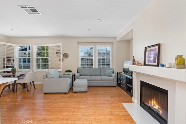 37 Rumford St, Ladera Ranch, CA 92694 - living area with light wood-style floors, a premium fireplace, recessed lighting, and baseboards