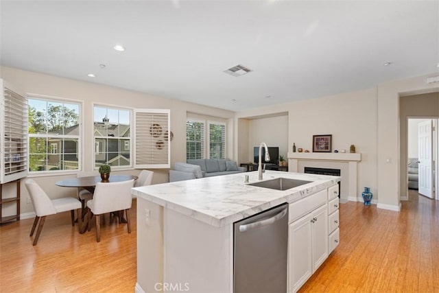 37 Rumford St, Ladera Ranch, CA 92694 - kitchen with dishwasher, a sink, light wood finished floors, white cabinetry, and open floor plan