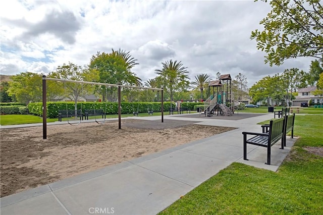 surrounding community with playground community and a yard