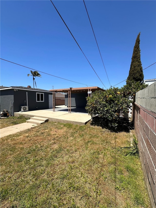 view of yard with fence and a patio area