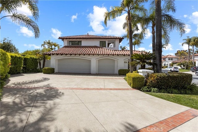 31 Terraza Del Mar, Dana Point, CA 92629 - mediterranean / spanish-style home featuring a tile roof, stucco siding, concrete driveway, and a garage