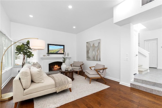 31 Terraza Del Mar, Dana Point, CA 92629 - living room featuring dark wood-type flooring, a lit fireplace, stairs, recessed lighting, and baseboards