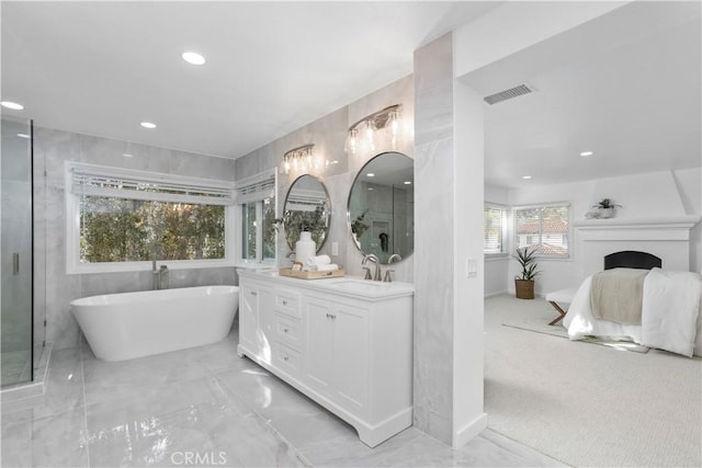 31 Terraza Del Mar, Dana Point, CA 92629 - bathroom with double vanity, a soaking tub, recessed lighting, ensuite bath, and marble finish flooring
