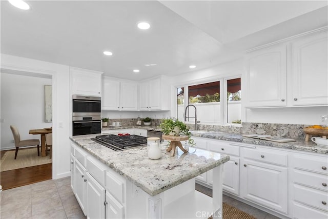 31 Terraza Del Mar, Dana Point, CA 92629 - kitchen featuring appliances with stainless steel finishes, a center island, white cabinetry, recessed lighting, and a sink
