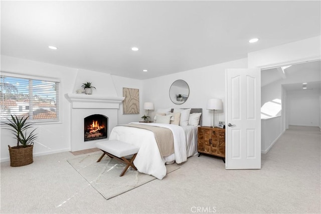 31 Terraza Del Mar, Dana Point, CA 92629 - bedroom featuring light carpet, a large fireplace, recessed lighting, and baseboards