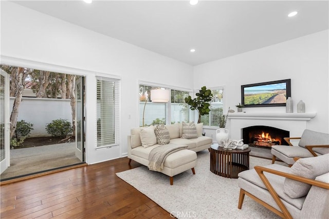 31 Terraza Del Mar, Dana Point, CA 92629 - living room with a lit fireplace, hardwood / wood-style flooring, and recessed lighting
