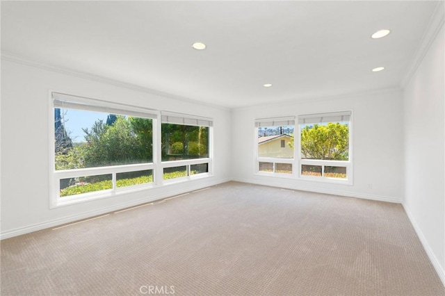 carpeted spare room with baseboards, recessed lighting, and ornamental molding