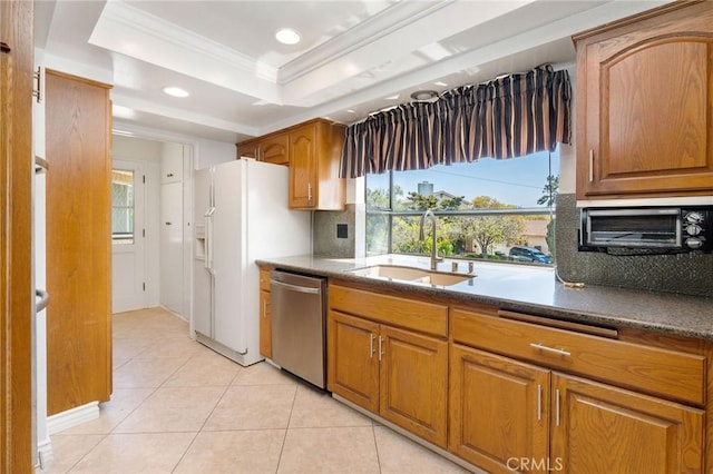 kitchen with a sink, light tile patterned flooring, dishwasher, ornamental molding, and recessed lighting
