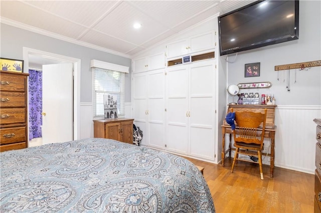 7744 Rhea Ave, Reseda, CA 91335 - bedroom featuring light wood-style floors, ornamental molding, a wainscoted wall, a closet, and vaulted ceiling