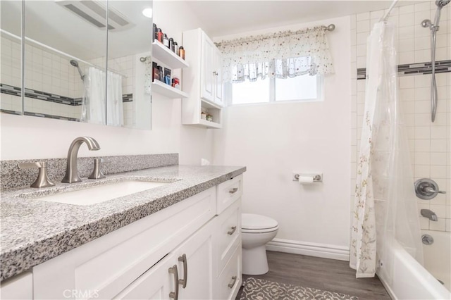 7744 Rhea Ave, Reseda, CA 91335 - full bathroom featuring vanity, toilet, shower / tub combo with curtain, wood finished floors, and baseboards
