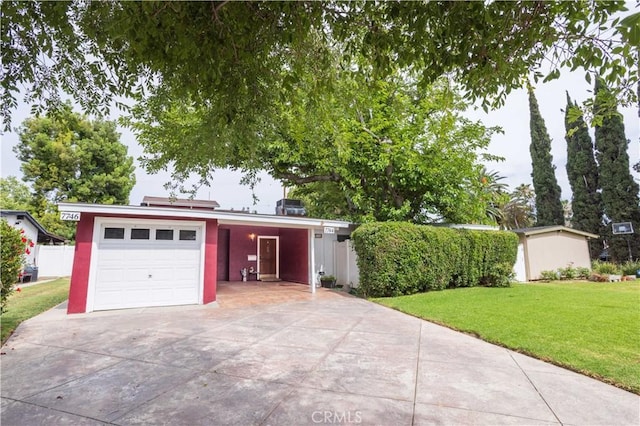 7744 Rhea Ave, Reseda, CA 91335 - garage featuring concrete driveway and a carport