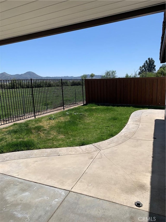 18810 Oakview Way, Lake Elsinore, CA 92530 - fenced backyard featuring a mountain view and a patio