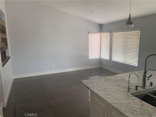 18810 Oakview Way, Lake Elsinore, CA 92530 - unfurnished dining area with a sink and dark tile patterned floors