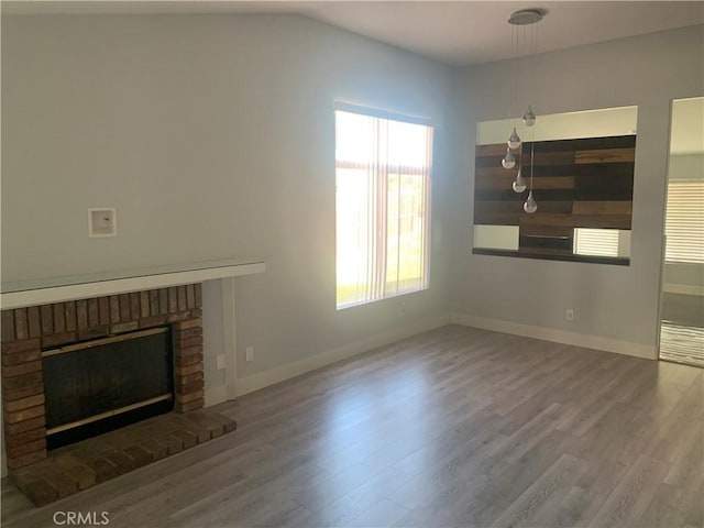 18810 Oakview Way, Lake Elsinore, CA 92530 - unfurnished living room featuring wood finished floors and a fireplace