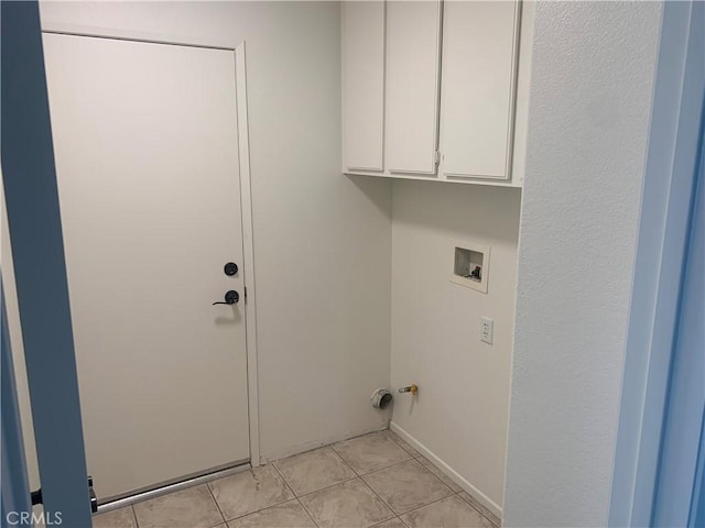 18810 Oakview Way, Lake Elsinore, CA 92530 - washroom featuring cabinet space, washer hookup, and light tile patterned floors
