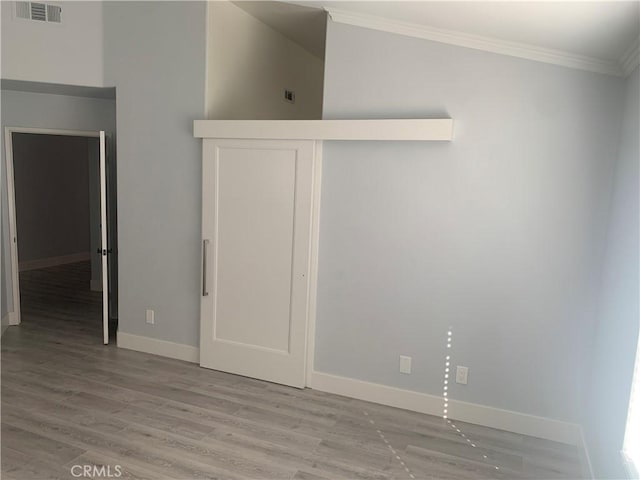 18810 Oakview Way, Lake Elsinore, CA 92530 - unfurnished bedroom with ornamental molding, wood finished floors, and a closet