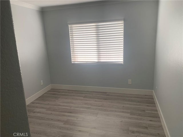 18810 Oakview Way, Lake Elsinore, CA 92530 - unfurnished room with crown molding and wood finished floors