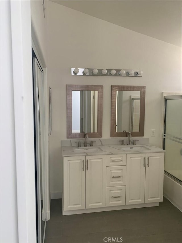 18810 Oakview Way, Lake Elsinore, CA 92530 - full bath with double vanity, tile patterned floors, and lofted ceiling