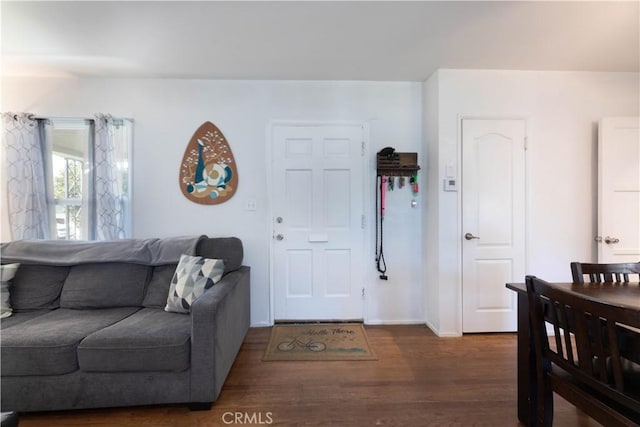 living room with wood finished floors and baseboards