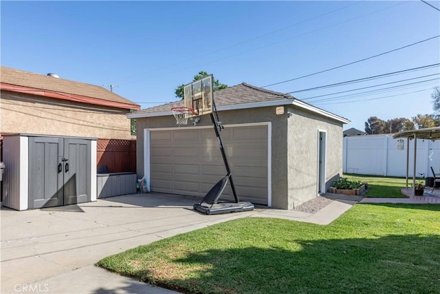 detached garage featuring fence