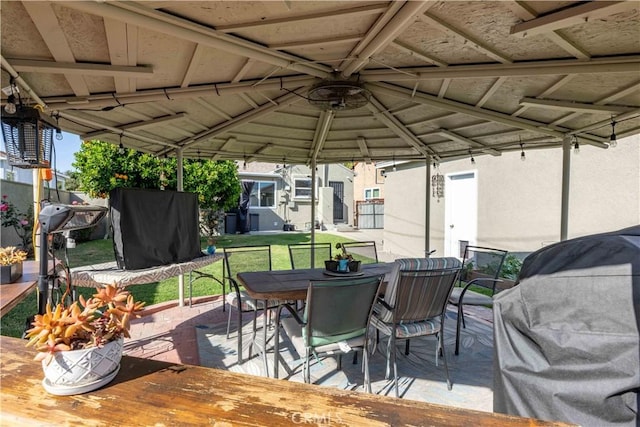 view of patio featuring a gazebo and outdoor dining area
