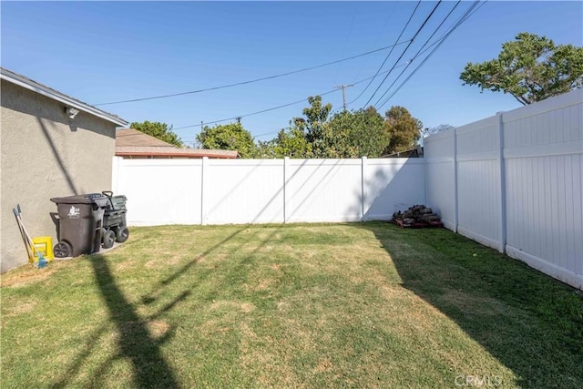 view of yard with a fenced backyard