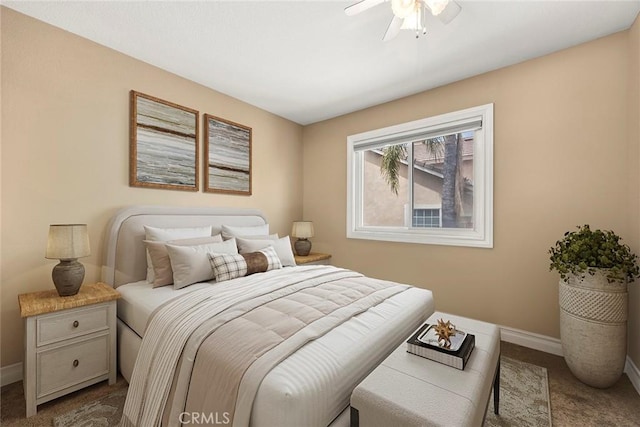 bedroom with baseboards, a ceiling fan, and carpet flooring