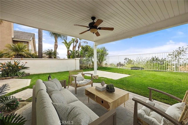 view of patio featuring a fenced backyard, an outdoor living space, and a ceiling fan