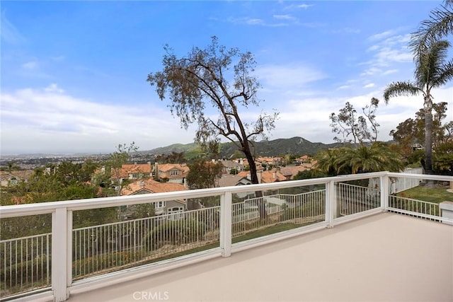 balcony with a mountain view and a residential view