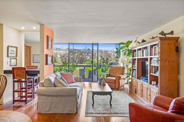 2564 Navarra Dr Unit 113, Carlsbad, CA 92009 - living room featuring wood finished floors, floor to ceiling windows, and recessed lighting