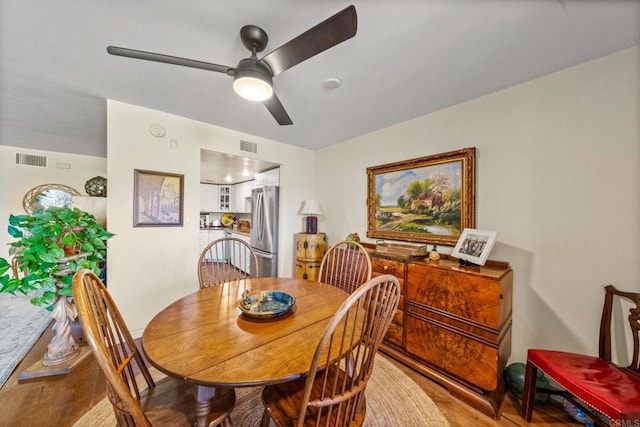 2564 Navarra Dr Unit 113, Carlsbad, CA 92009 - dining area featuring a ceiling fan and wood finished floors