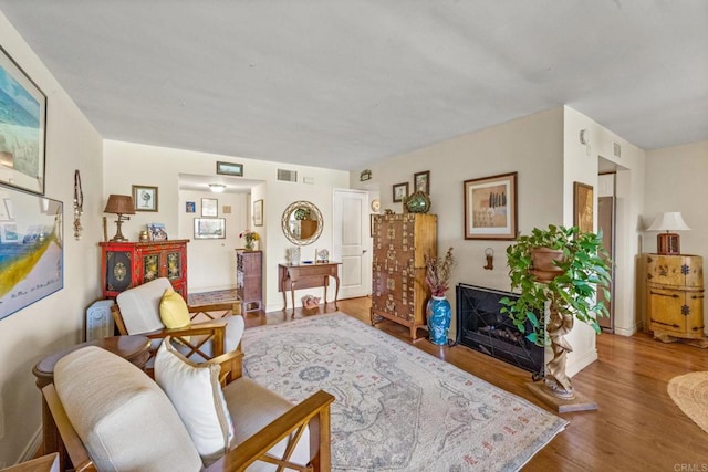 2564 Navarra Dr Unit 113, Carlsbad, CA 92009 - living room featuring wood finished floors and baseboards
