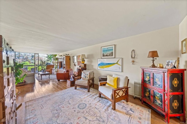 2564 Navarra Dr Unit 113, Carlsbad, CA 92009 - sitting room featuring hardwood / wood-style floors and radiator